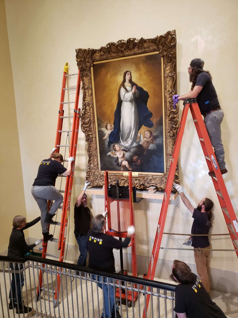 Installation with wall placement of large art - Bartolome Esteban Murillo the immaculate conception 1655-60 over stairs